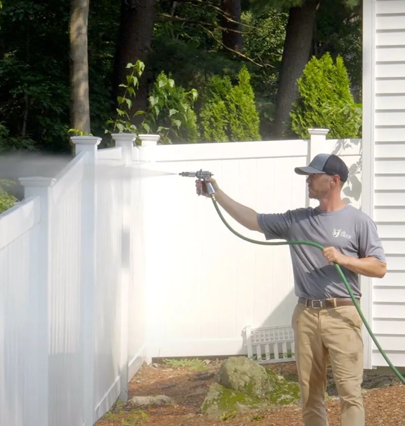 ohDEER technician spraying garden  against deer