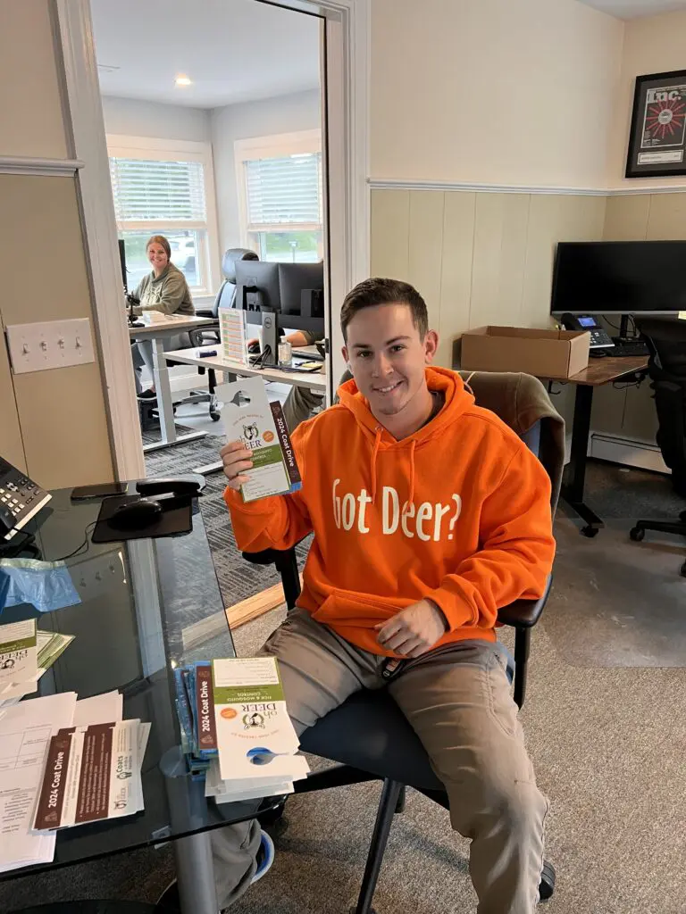 ohDEER technician and office staff with coat drive materials and got deer hoodie 