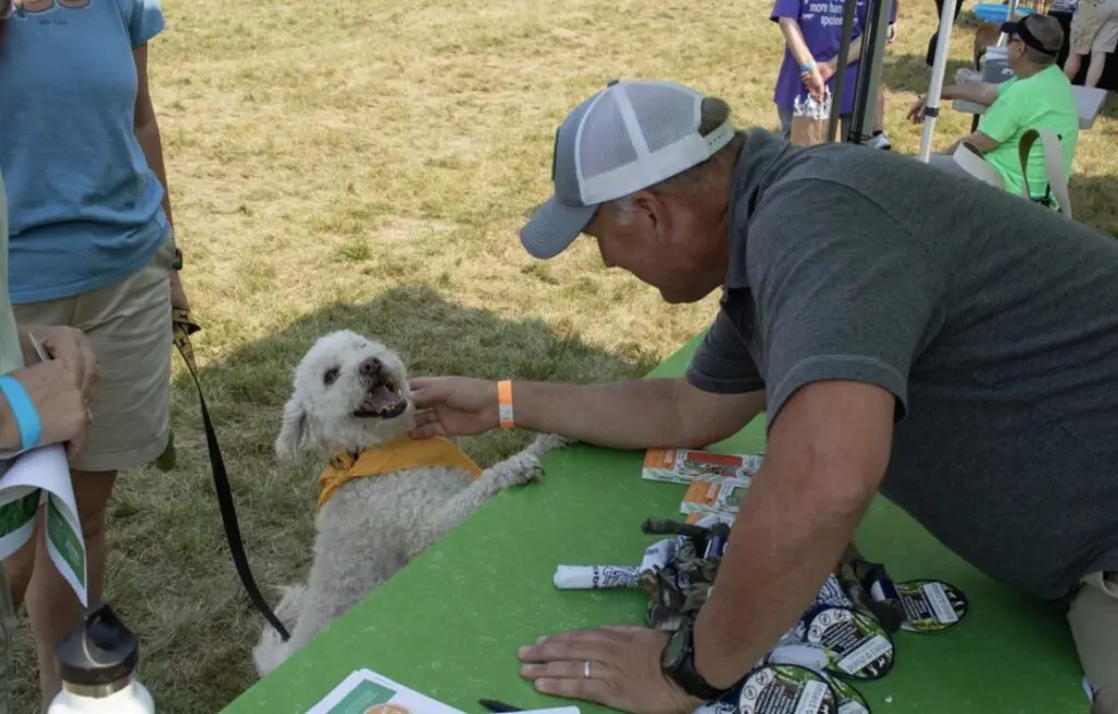 ohDEER founder Kurt Upham petting dog 
