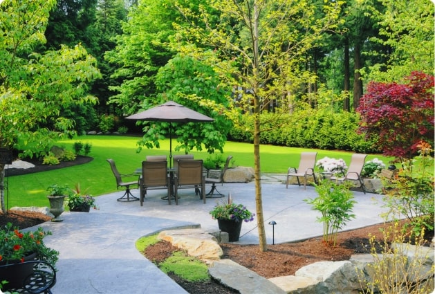 Image of a lovely backyard patio that can be enjoyed because it has tick control services performed.
