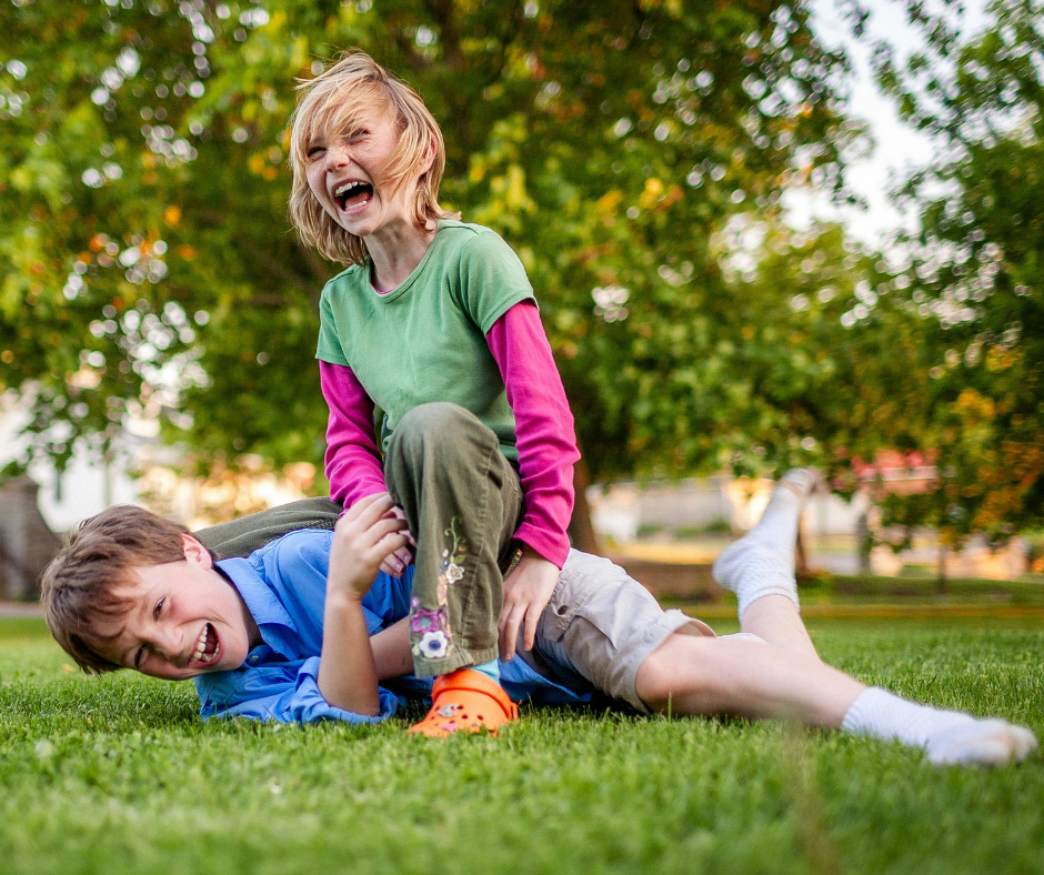 kids playing outside on the grass 