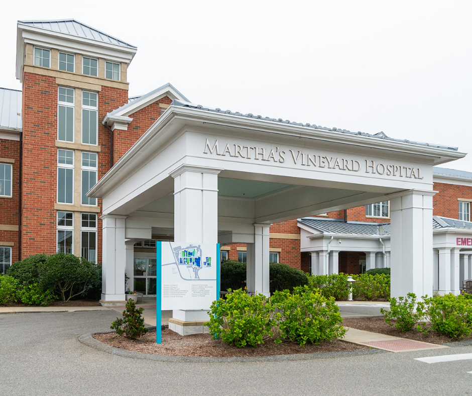 The Martha's Vineyard Hospital main entrance features a large white canopy over a red brick building.